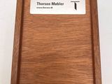 a wooden plaque with the name of a person on it