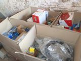 many boxes of various items in a box on the floor