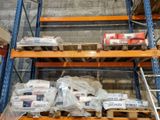 many boxes and packages on the shelves in the warehouse