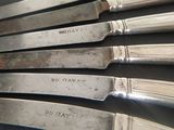 five knives that are sitting on top of each other