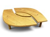 two pieces of wood sit on top of each other on a white surface