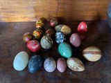 a lot of different colored rocks on the table