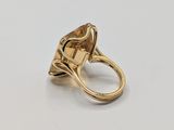 a close up of a ring with a large stone in it