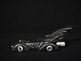 a toy car with a batmobile on top of it