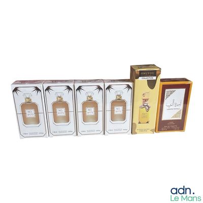 three boxes of perfume and a box of perfume on a white background