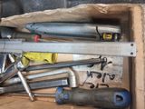 a box full of tools that are sitting on the floor