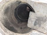 an image of a dirty toilet with a hole in it