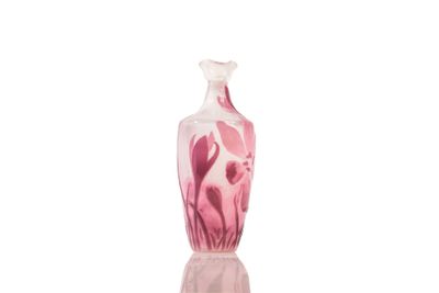 pink and white glass vase on a white background with reflection