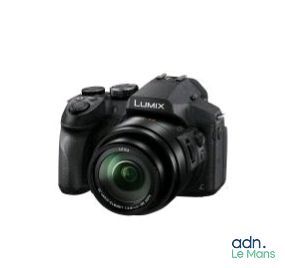 the front of a digital camera with a lens attached to it