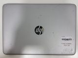 a laptop with a sticker on it sitting on a table