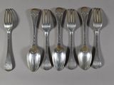 six silver spoons and a fork are lined up on a white surface