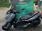 a picture of a motorcycle parked in front of a sign