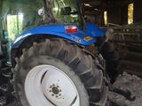 a tractor that is parked in a barn
