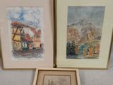 two framed watercolor paintings of a village and a mountain scene