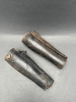 two pieces of metal are sitting on top of a table
