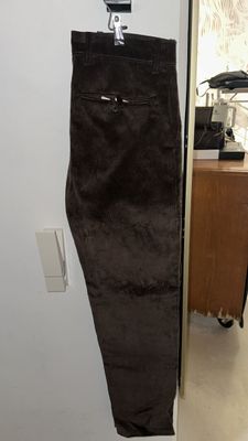 a picture of a pair of brown pants hanging on a wall