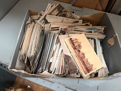 a box full of old photos and other papers