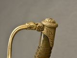 a close up of a gold colored handle on a cane