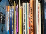 many books that are on a shelf in a book case