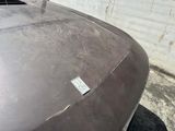 a close up of a car ' s hood with a sticker on it