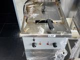 an image of a commercial fryer sitting on the floor