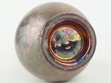 a glass vase with a colorful design on it