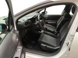 the interior of a car with the door open and the driver ' s seat down