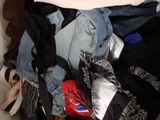 a pile of clothes that is sitting in a box