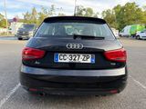 the back of a black audi car parked in a parking lot