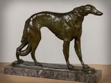 bronze sculpture of a greyhound dog on a marble base