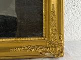 a man taking a picture of himself in a mirror
