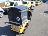 a small cart that is sitting in the middle of a parking lot