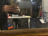 a woman taking a picture of herself in a mirror