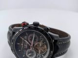a watch that is sitting on a white surface