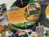 the contents of a garden hose, watering hose, sprinkler, and other garden tools
