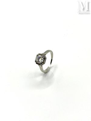 an image of a diamond ring on a white surface