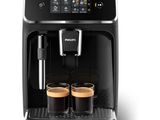 a black coffee machine with two cups of coffee in front of it