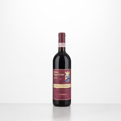a bottle of red wine sitting on top of a table