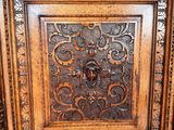 an old wooden door with ornate carvings on the front of it