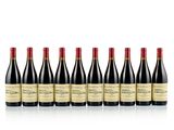 six bottles of red wine lined up in a row