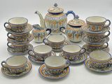 a lot of cups and saucers that are sitting on a table