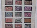 framed picture of a collection of stamps of different countries in a white frame