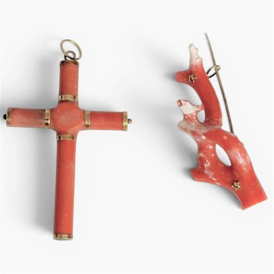 two red crosses on a white surface next to each other