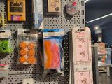 many different items hanging on the wall in the store