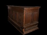 an old wooden chest with carvings on the sides