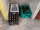 two crates of beer sitting next to each other on the floor