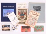 many books that are sitting on a white table