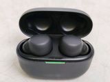 a pair of earphones in a case on a table