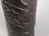 a metal cup with a picture of a bird on it
