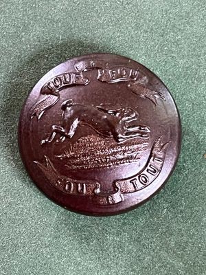 une pièce de monnaie marron sur laquelle est représenté un cheval